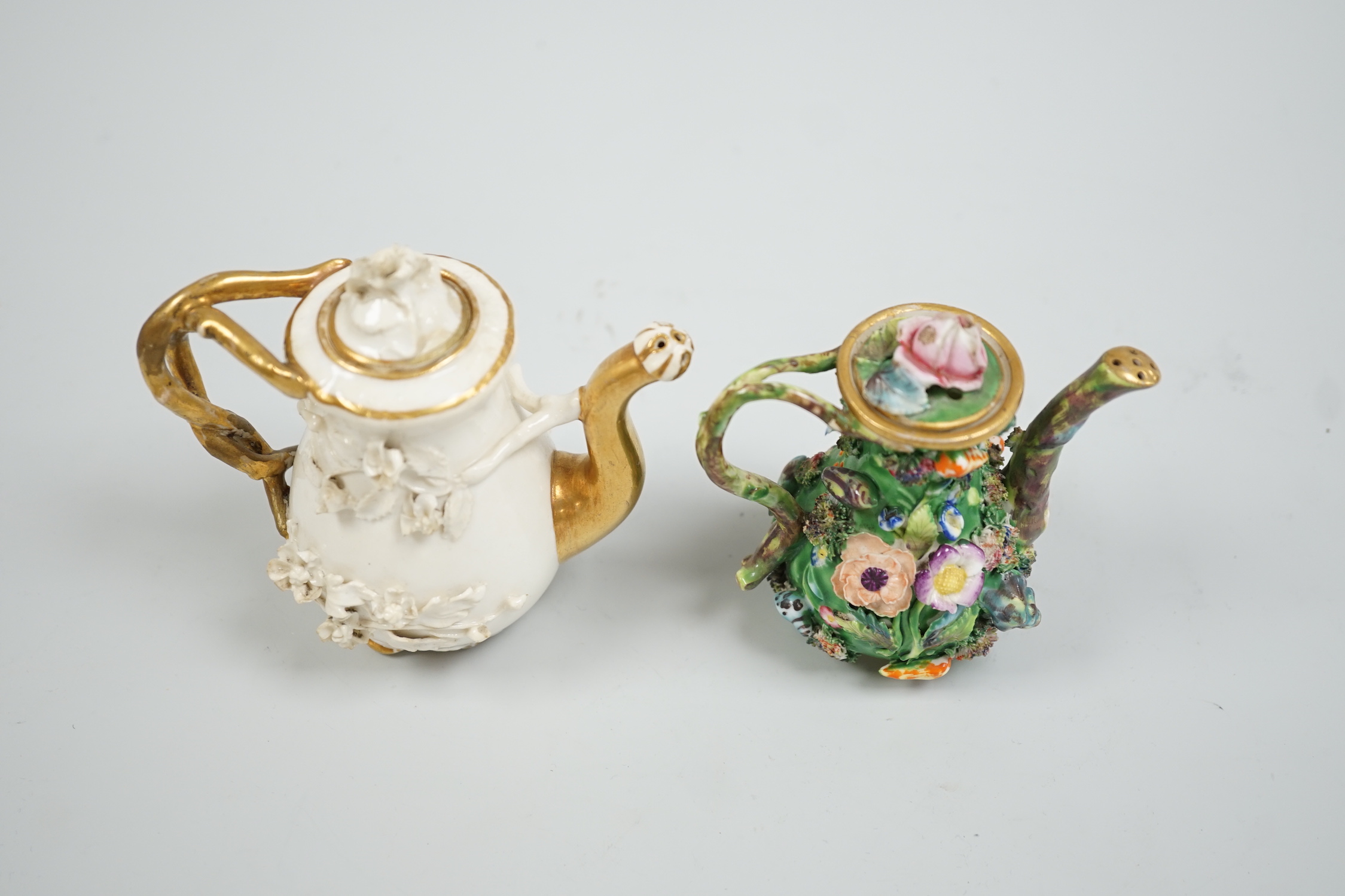 Toy porcelain. A Rockingham flower encrusted rosewater sprinkler and an English porcelain flower encrusted rosewater sprinkler, probably Spode, c.1830, the former with gilt model no. ‘C1’, tallest 10.5cm high